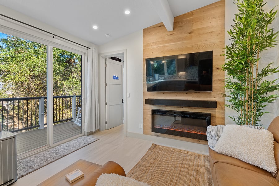 Common living area with cozy fireplace and TV
