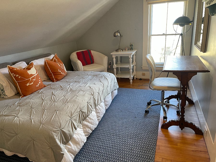 This is a second room that can be used to watch TV or as a guest room.