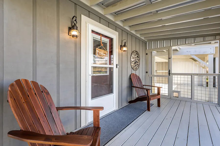 Seating for two on the covered portion of the front porch