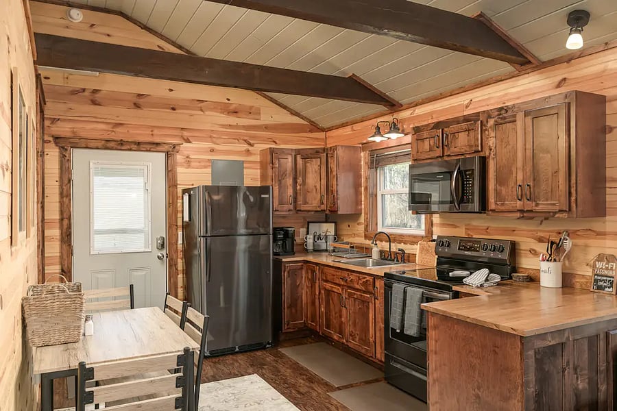Kitchen is equipped with appliances and basics needed for staying in and cooking a meal