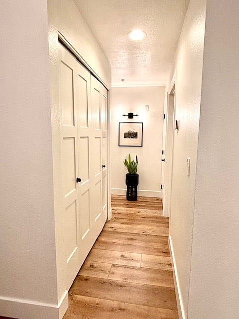 Just off the hallway, the laundry closet is thoughtfully equipped with a full-sized Maytag washer and dryer, blending practicality with convenience.