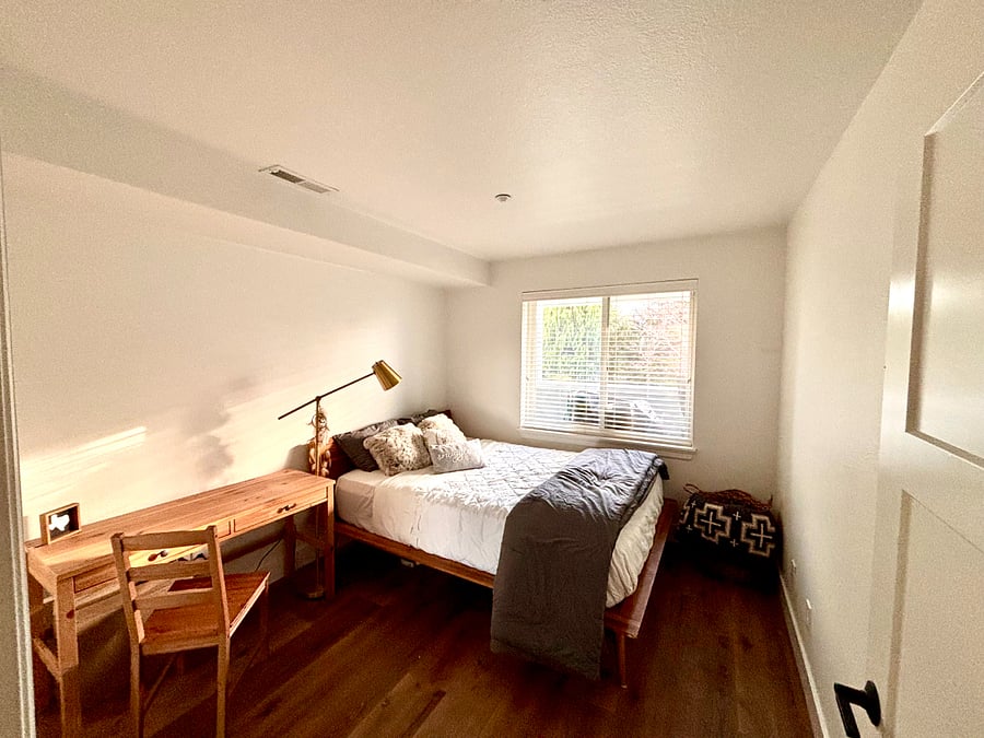 Step into a bedroom designed for ultimate comfort and tranquility. At its heart lies a queen-sized plush mattress topped with a luxurious 4-inch Tempur-Pedic topper, promising restful nights and rejuvenating mornings. Dressed in crisp white linens, the bed exudes elegance and invites you to sink into its cozy embrace.