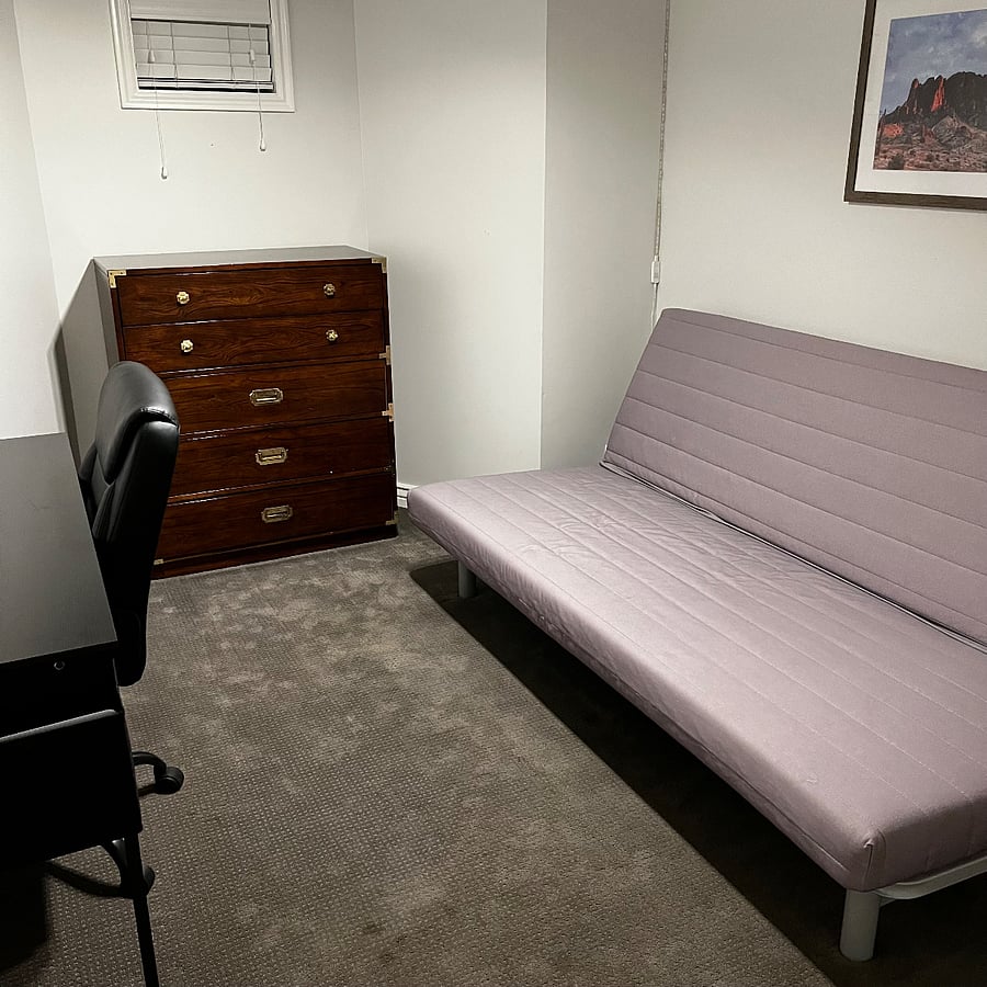 Downstairs small office/fourth bedroom with a futon.