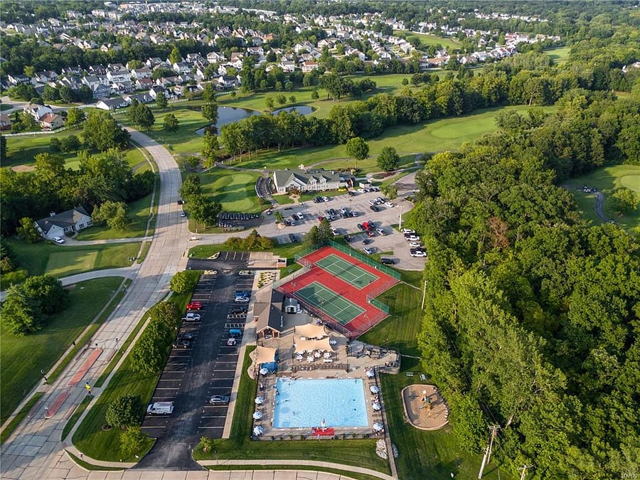 Aerial view of our pool, tennis/pickleball courts & The Falls Public Clubhouse.