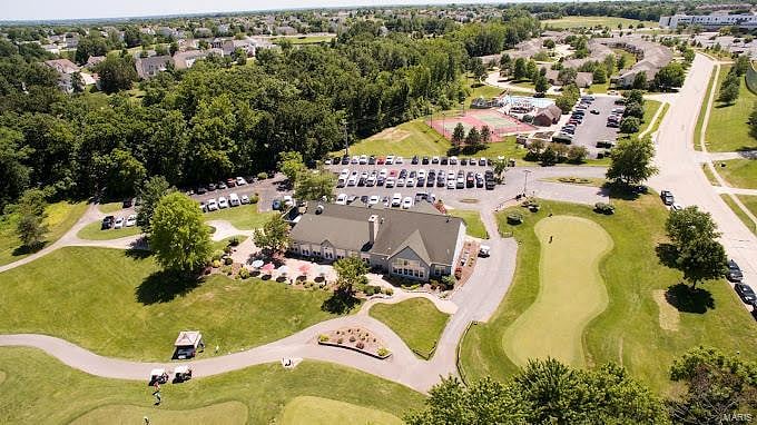Aerial view of back of The Falls (Public) Golf Course & our pool & courts just behind.