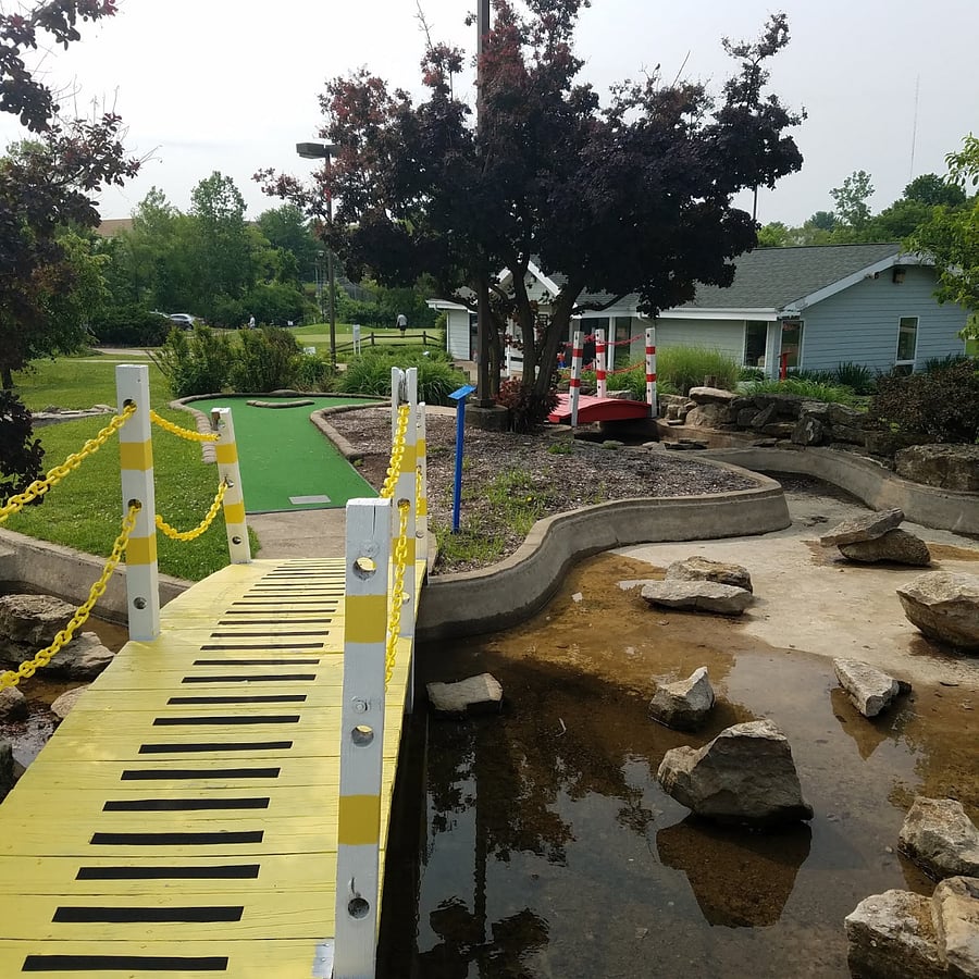 Mini-golf bridge to sign-in building.