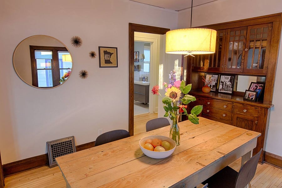 Our Dining Room opens to a hallway to access the full Bathroom, the Yoga Room and the staircase to the second floor. 
