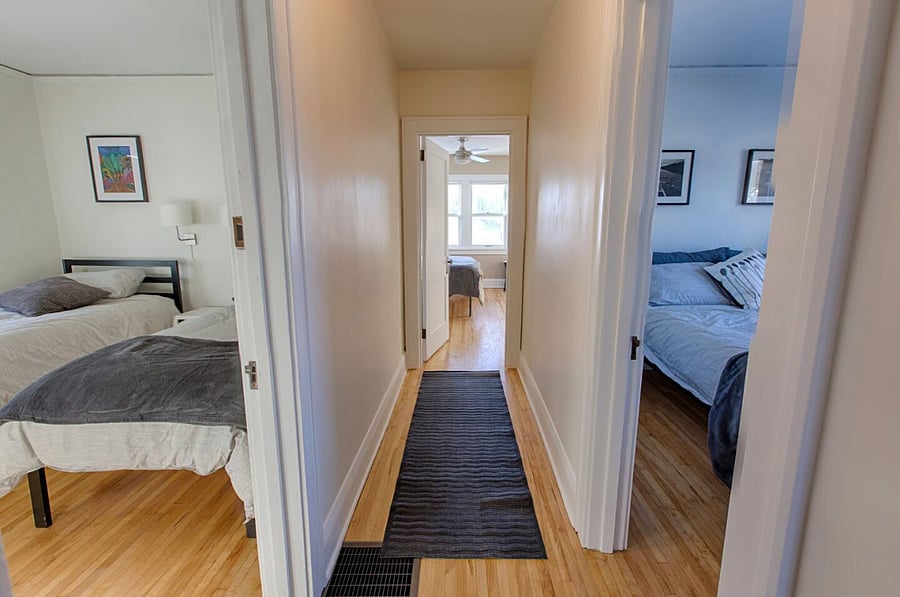The three bedrooms are located off the upstairs hallway. The second floor is accessible by staircase.  Please note that our Guesthouse was originally built in 1920, as such the stair tread depth is less than standard.  