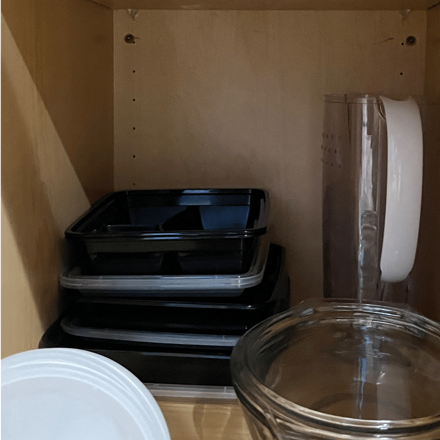 Microwave and stove items to cook with plus a pitcher and other food storage containers.