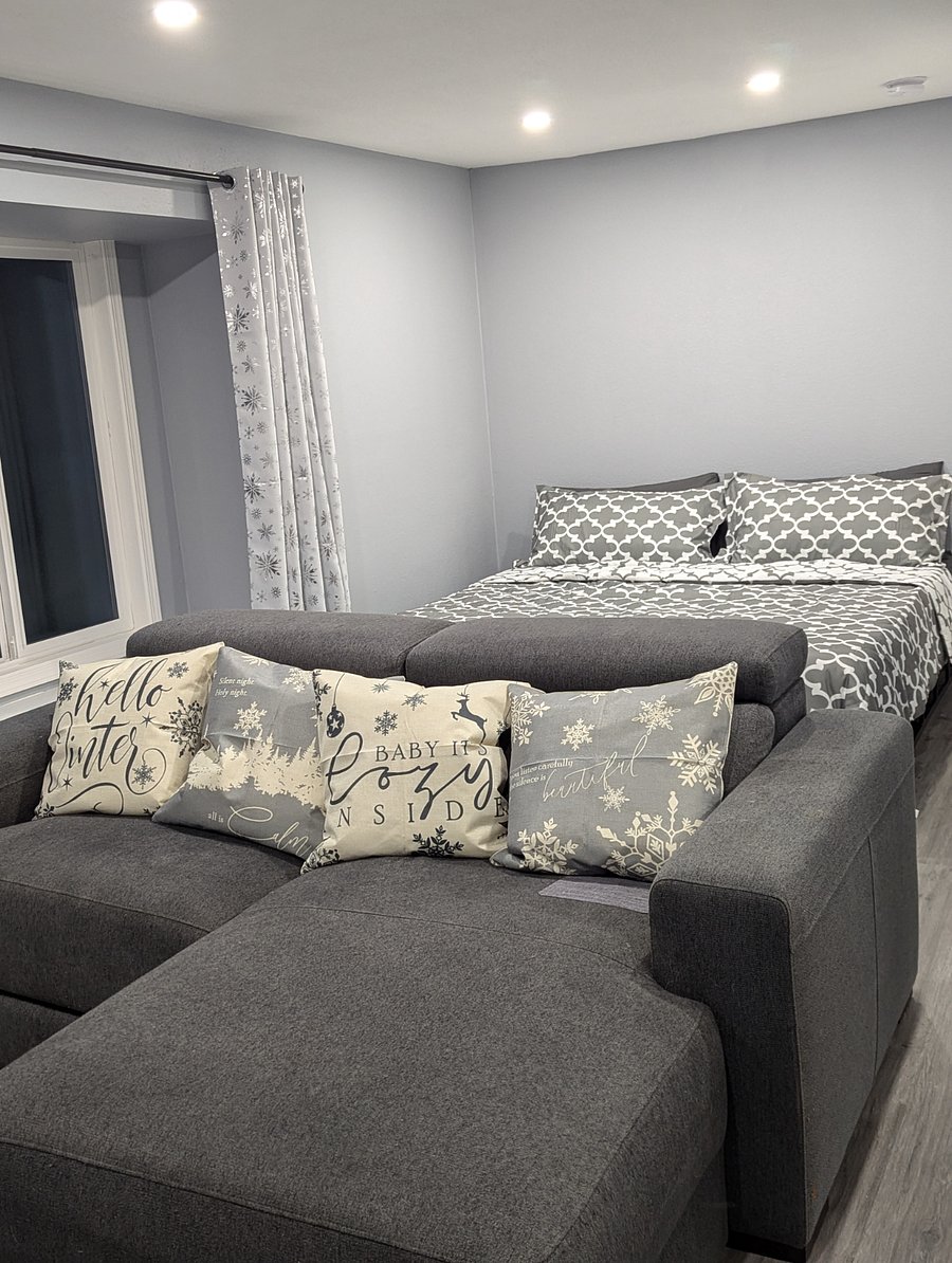 Sofa in front of the king-sized bed