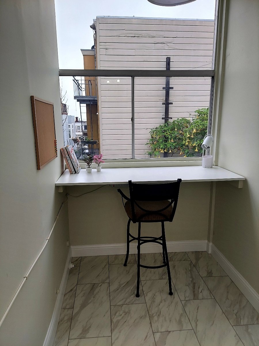 Work/craft space nook overlooks garden.