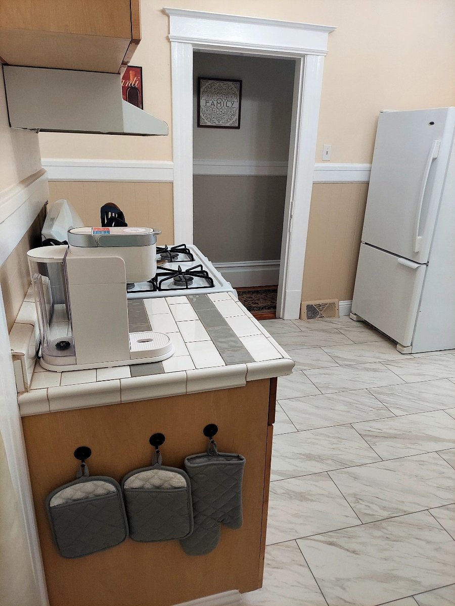 New kitchen flooring, full size fridge.