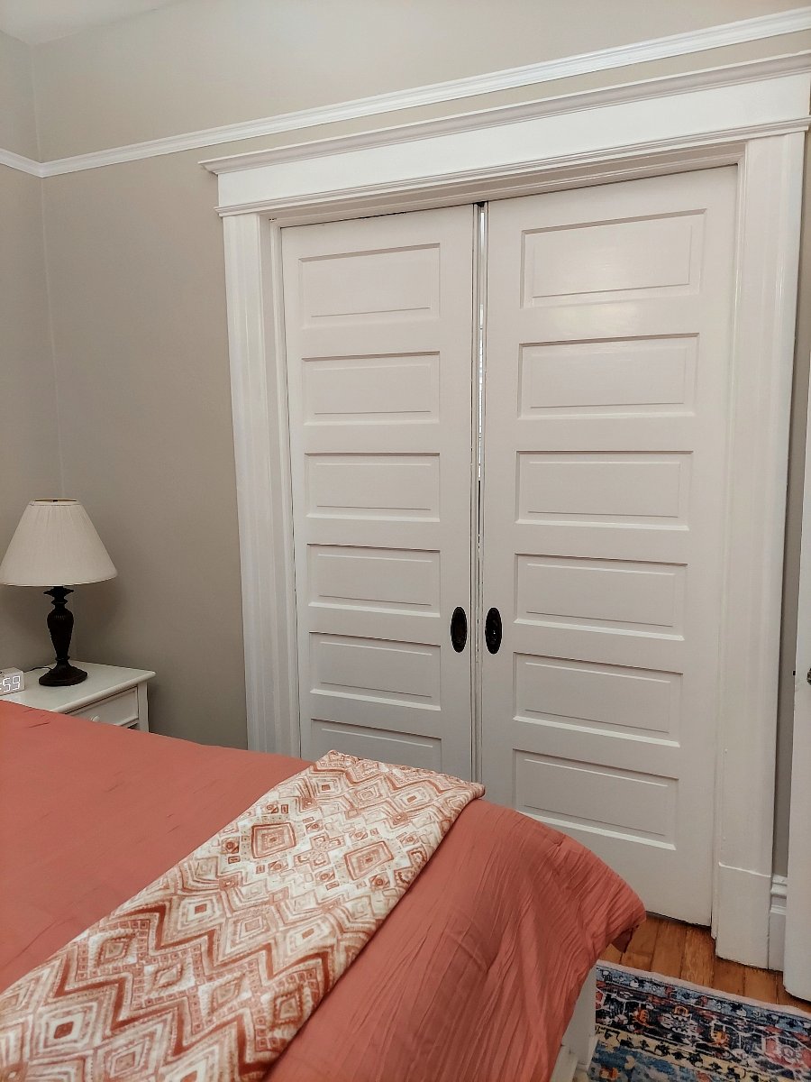 Pocket doors open on to separate living room from bedroom.