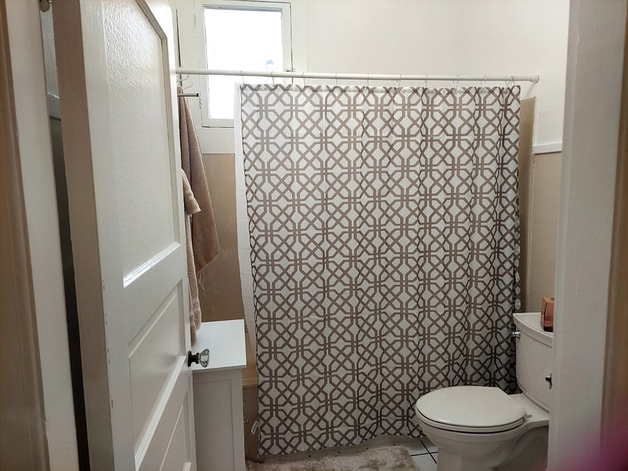 Bathroom at the end of the hall. Towels, shampoo, conditioner, soap, TP, cleaning products.