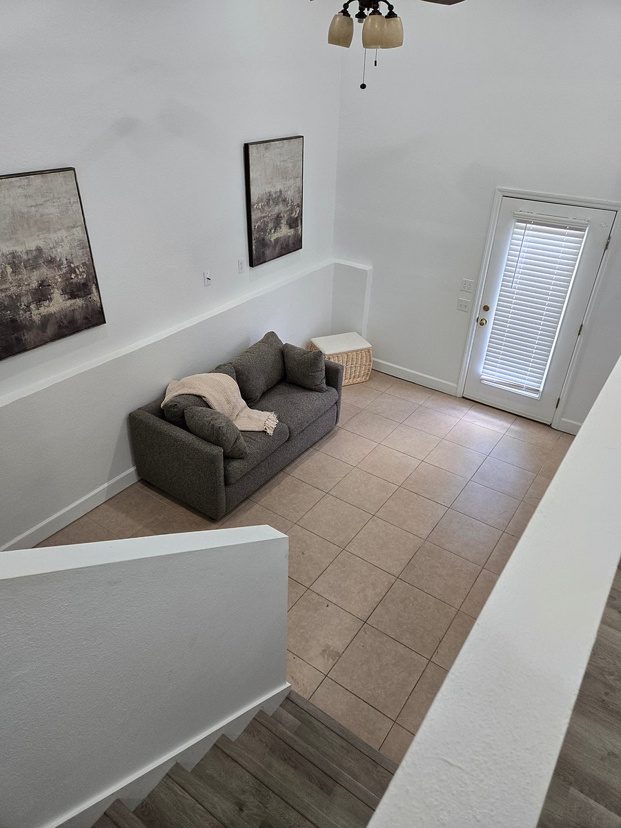 Den w/ sofa bed and entrance