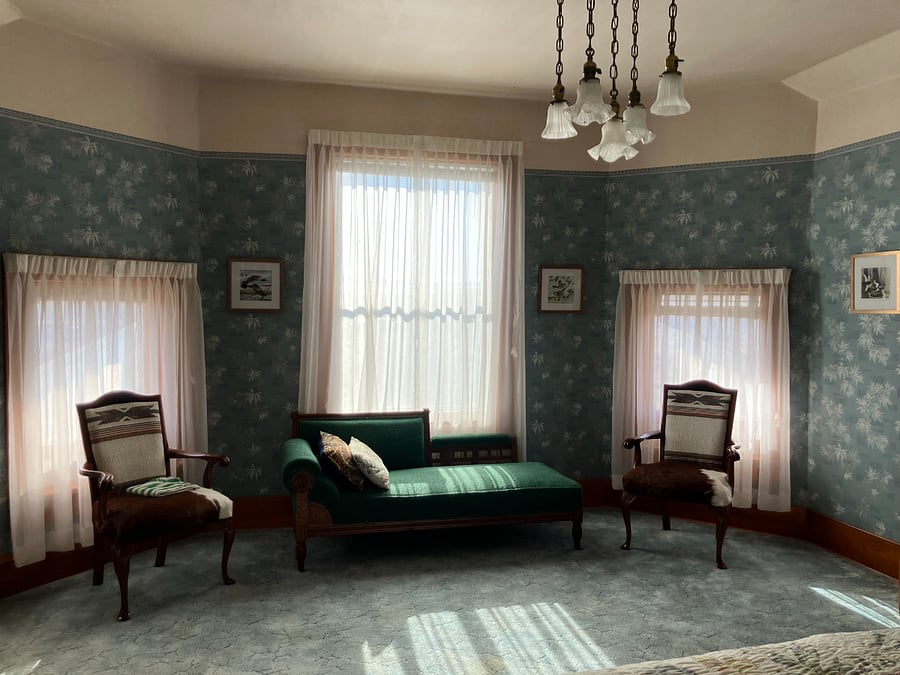 Cozy sitting area within the private queen suite