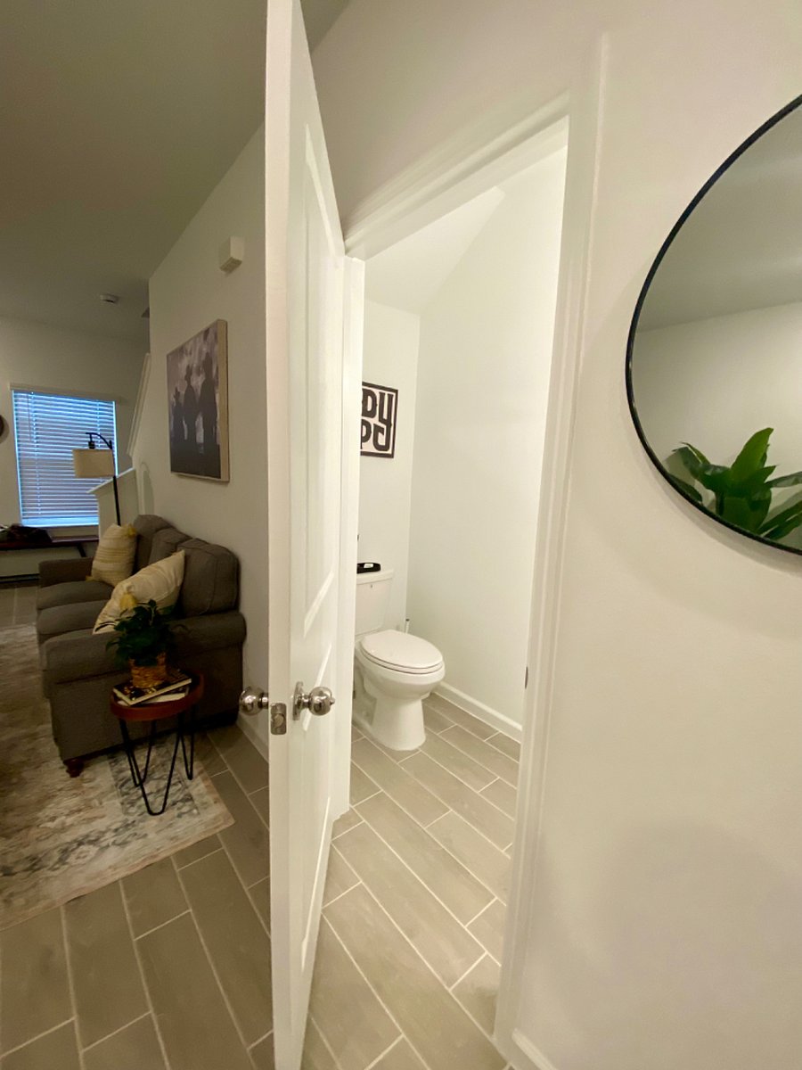Half bath on the first floor near living room.