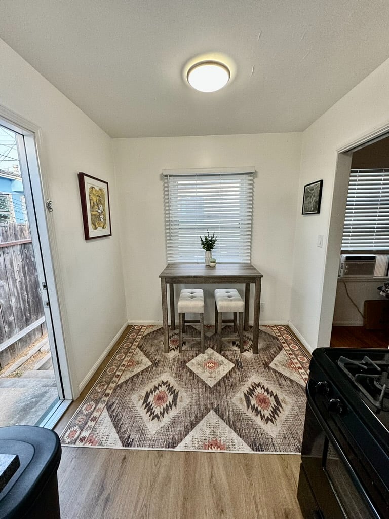 Kitchen dining area and back door.
