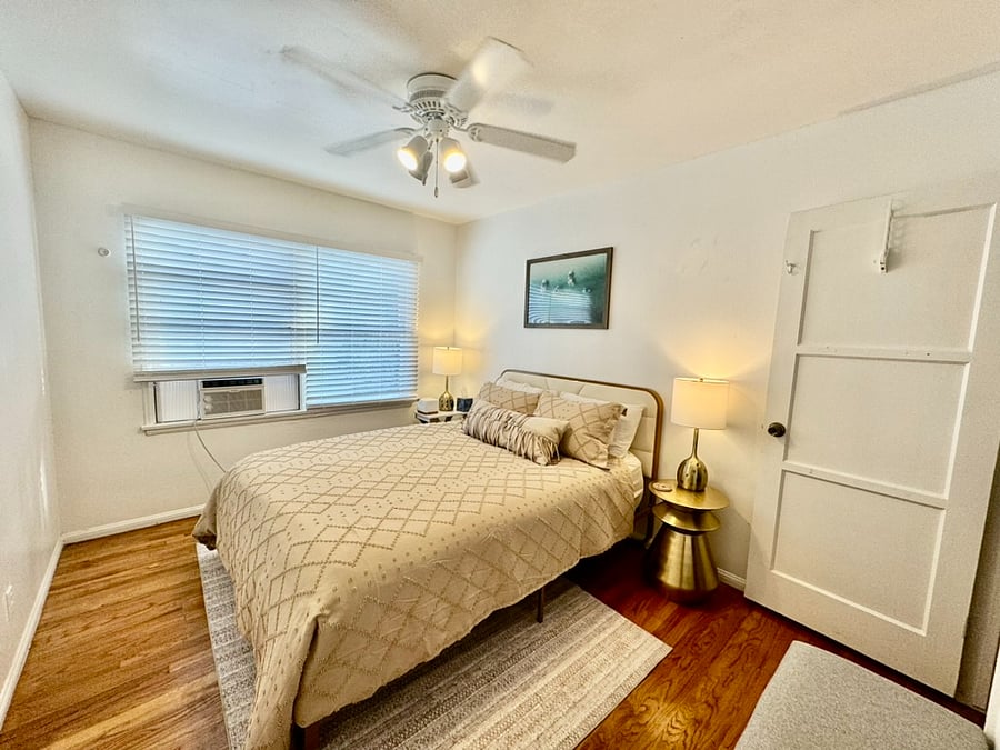 Queen Bedroom with closet and dresser.