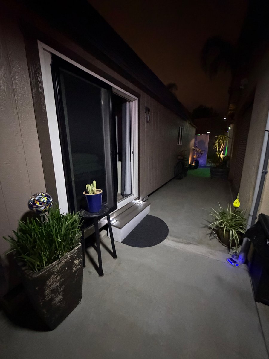 Sensor floodlights and solar lighting at night, area is well lit-up.