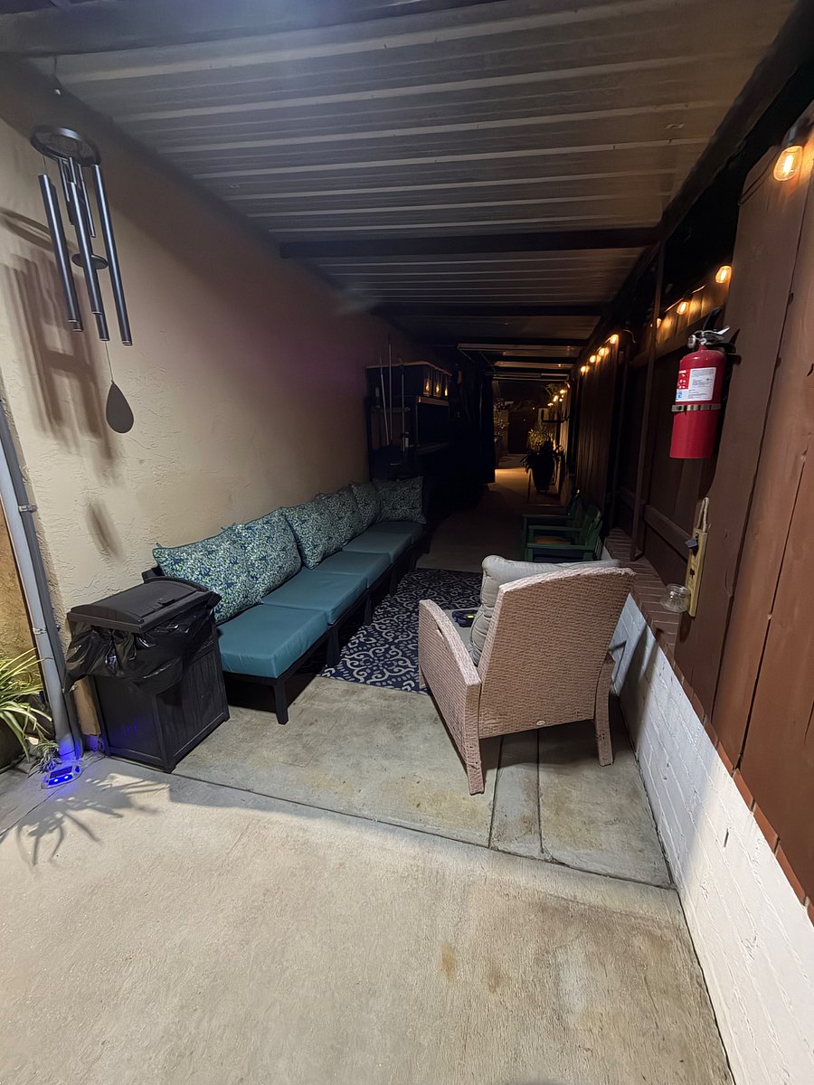 View form the patio area to the front of gate with solar string lights and sensor lighting. 