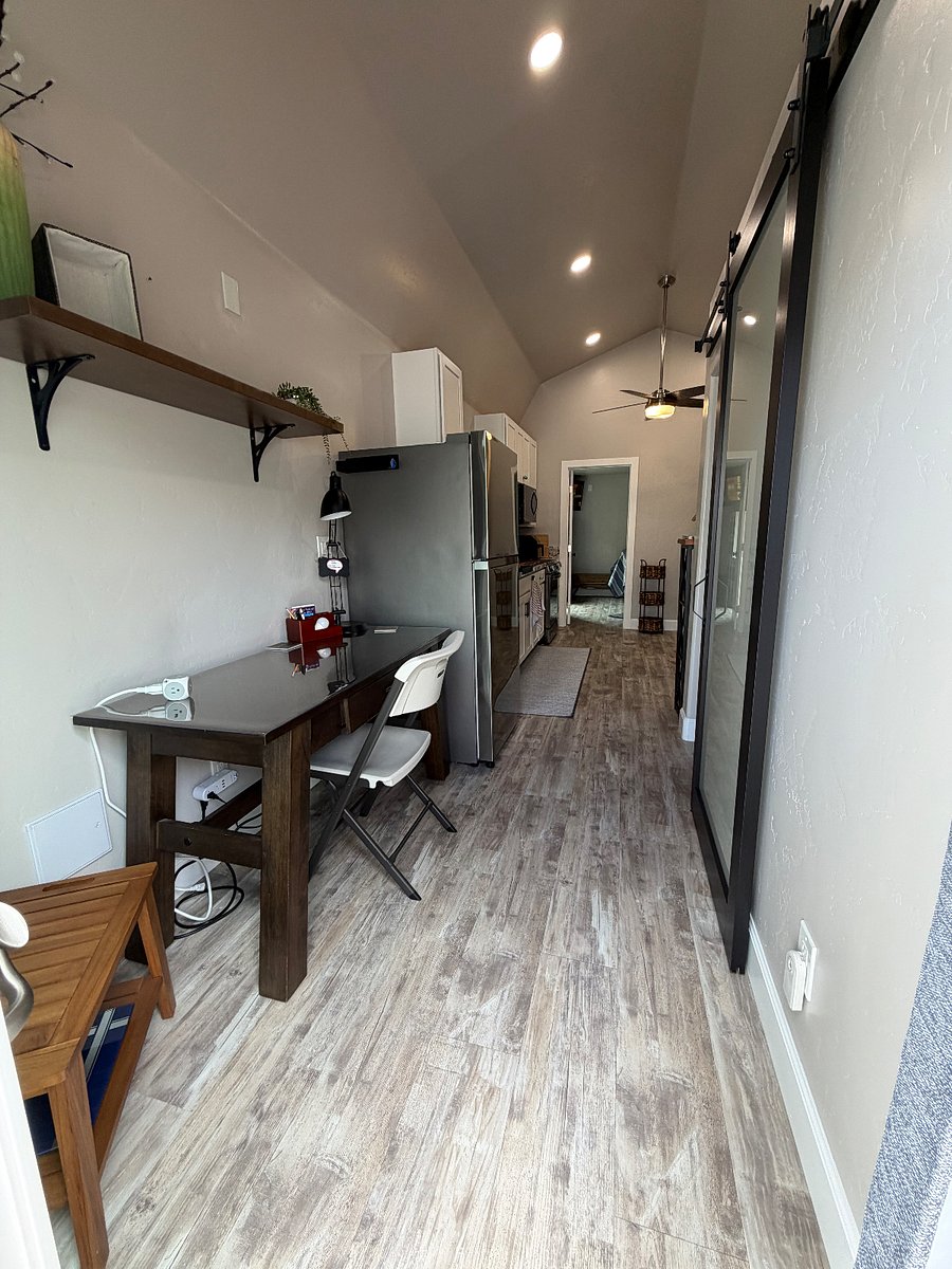 Back side of the Casita with additional glass slider entrance entering into desk area. 