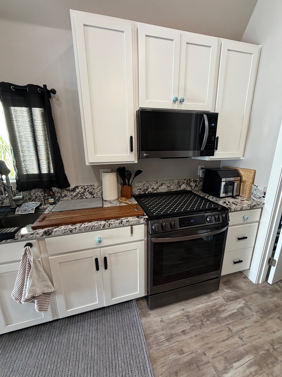 Full size microwave and e-stove.