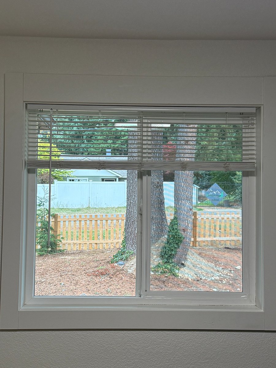 View outside the window in the room (the room faces the front of the house). Tenant may park in the unfenced area as seen in this photo.
