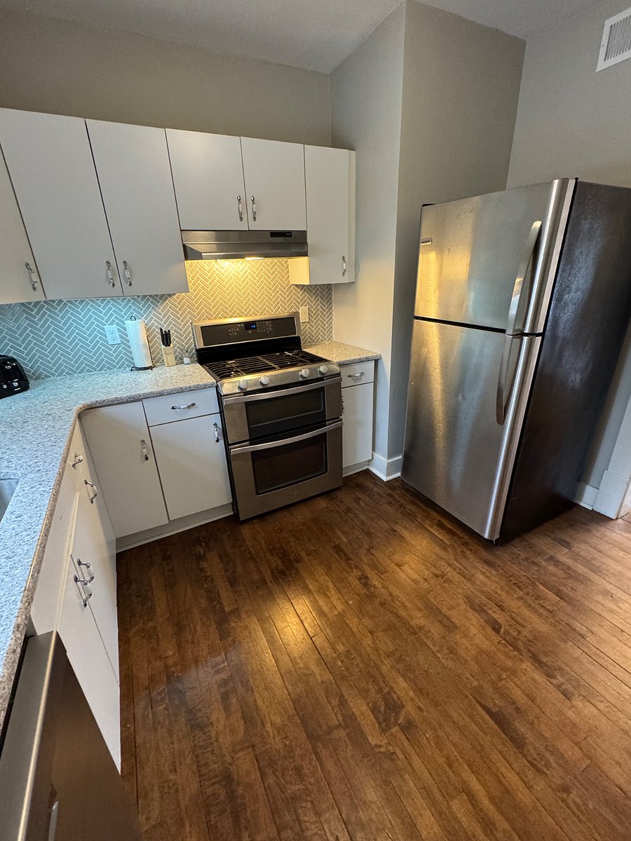 Kitchen with stainless steel appliances and quartz counters