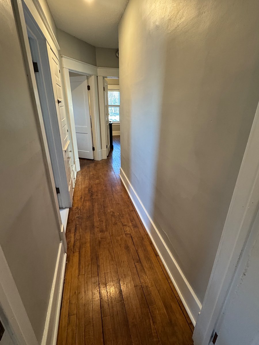 Hallway leads to bathroom, bedrooms, and home office