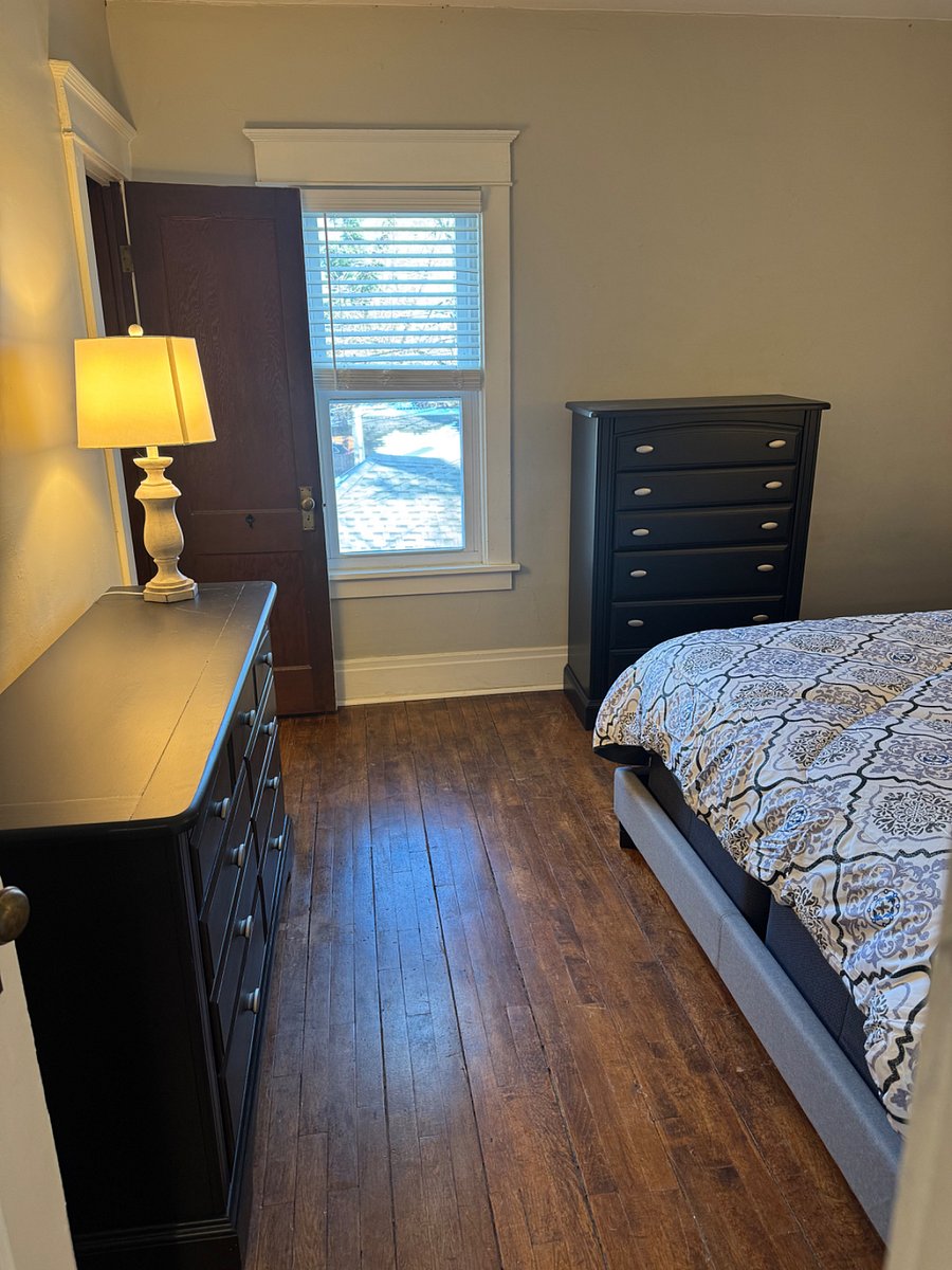 Bedroom 1: Queen-sized bed and two dressers