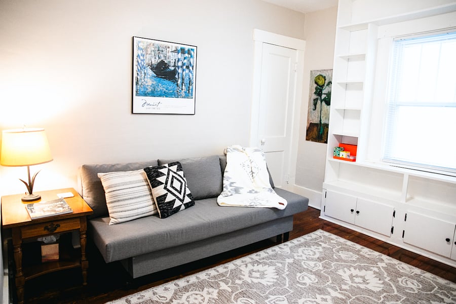 sofa bed for your guests that turns into the ccoziest sleeping space. Room doubles as a workout space for your morning yoga routine