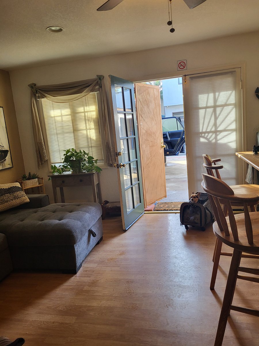Livingroom. french doors to patio enclosed area with one parking