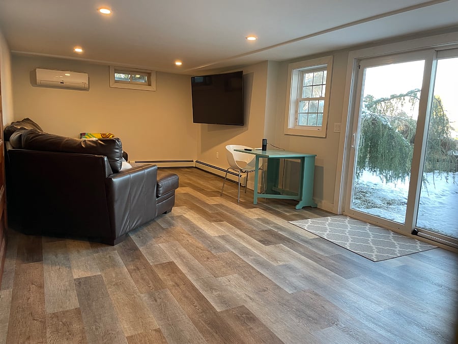 Family room with desk (remote work space) with water views