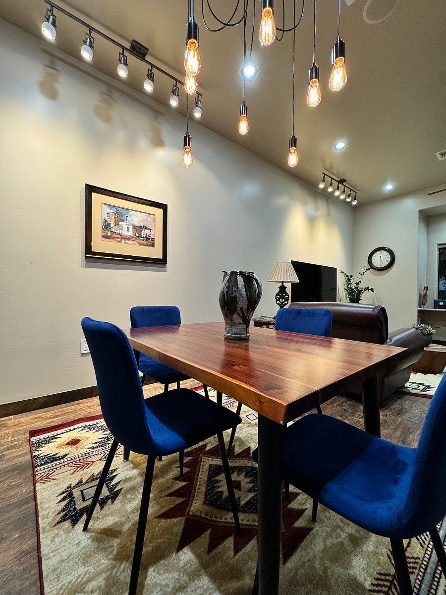 A beautiful Custom made Walnut dining table and plush bright blue velvet chairs