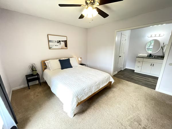 Master Bedroom-TV is on the wall across from bed