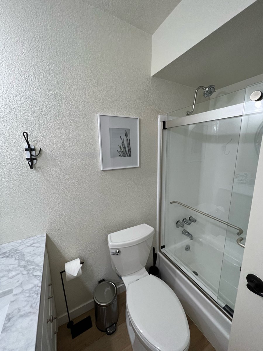 Main bathroom with full shower and tub.