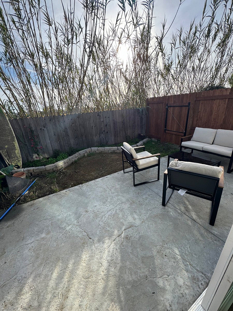 Small private backyard with sitting area
