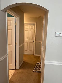 Guest hallway entrance, bathroom door open (left), and guest bedroom 1 (straight ahead)
