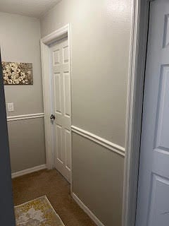 Hallway between the 2 guest bedrooms, guest bedroom 2 is on left and guest bedroom 1 is on right.