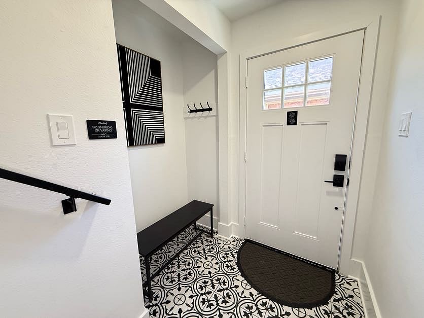 Keep things tidy and stylish with this entryway's designated coat and shoe area. Take a seat and make yourself at home. This entryway features a comfortable bench perfect for putting on shoes.