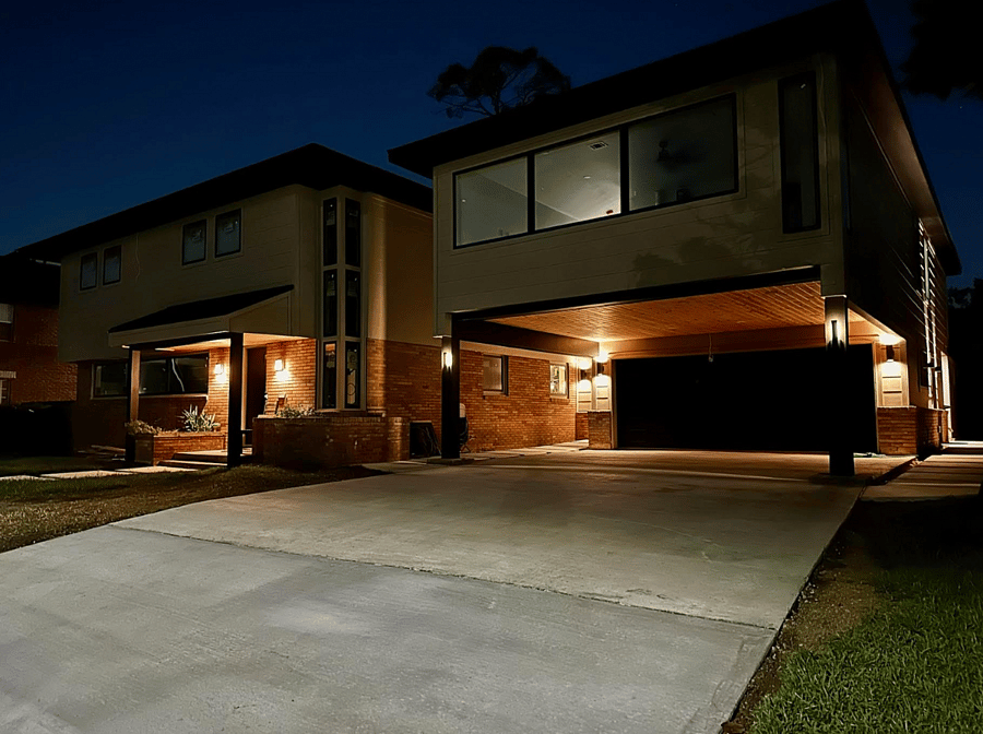 The home and apartment are well lit throughout and along the walkway on the right to the apartment.
