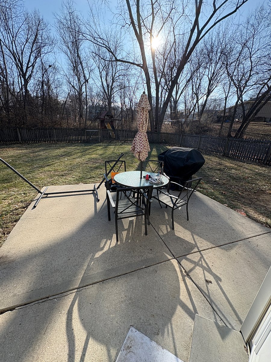 backyard with hammock, grill and patio set