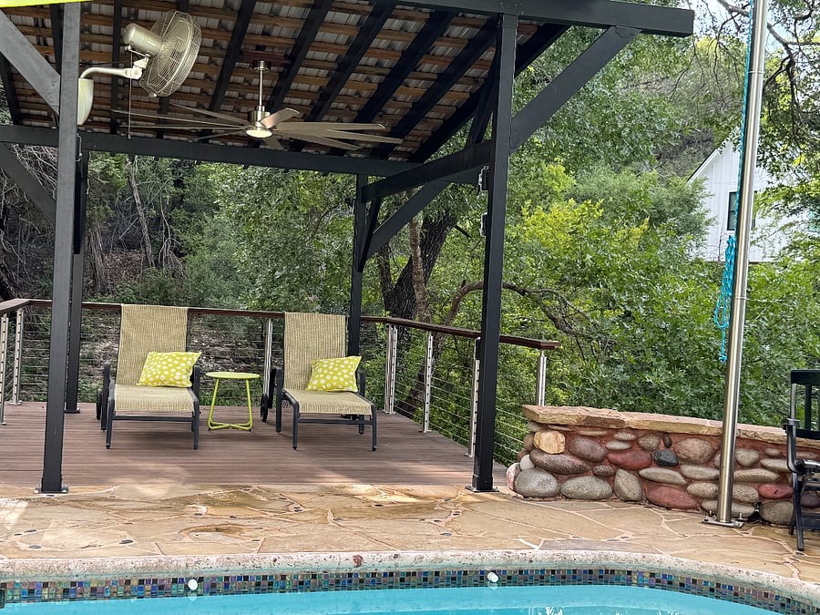 Covered pergola with fans and views