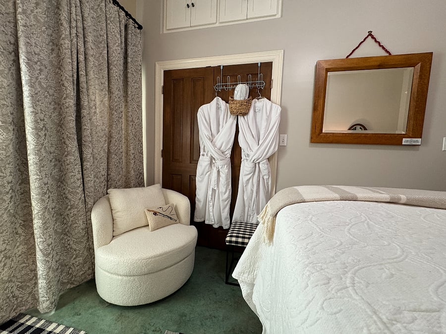 Poolside suite bedroom with chair