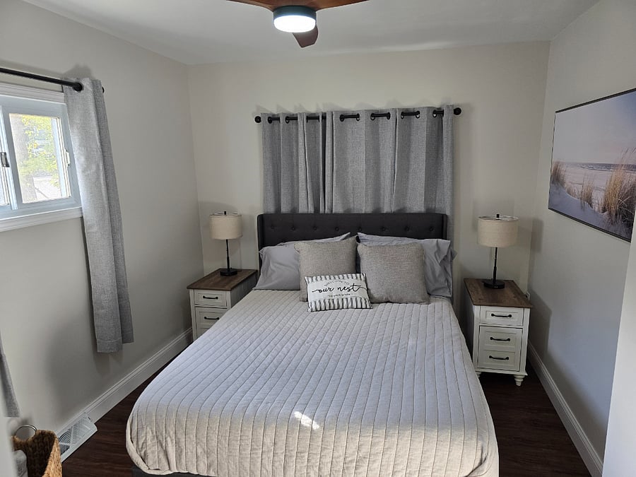 Main bedroom with closet and dresser and two nightstands. USB and extra plugs in nightstands.