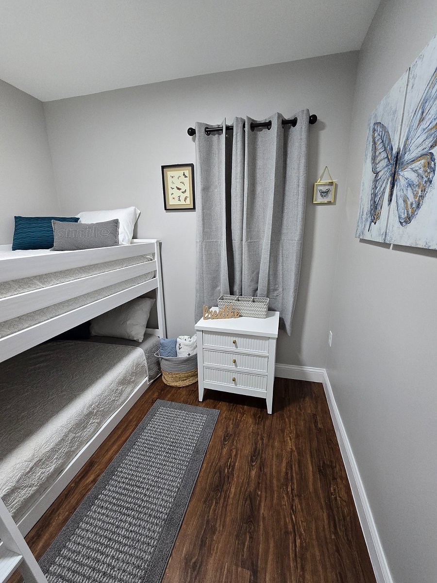 Second bedroom with two twin beds (bunk) with nightstand with drawers for storage.