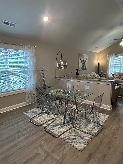 Open dining area to living room with vaulted ceilings