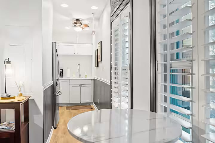 Full kitchen and small breakfast table and stools