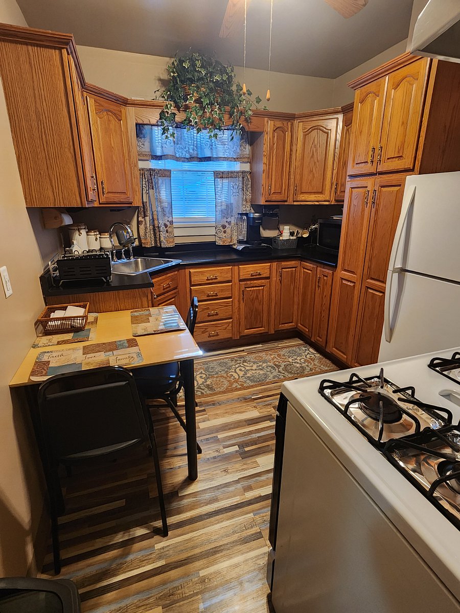 Fully furnished kitchen with small 2 person table.